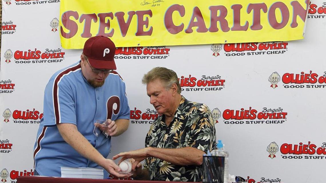 Hall of Fame pitcher Steve Carlton autographed a game ball for Andy Newman of Lexington during an autograph session at the grand opening of Ollie’s Bargain Outlet in Lexington. Carlton won four Cy Young Awards as the best pitcher in the National League with the Phillies.