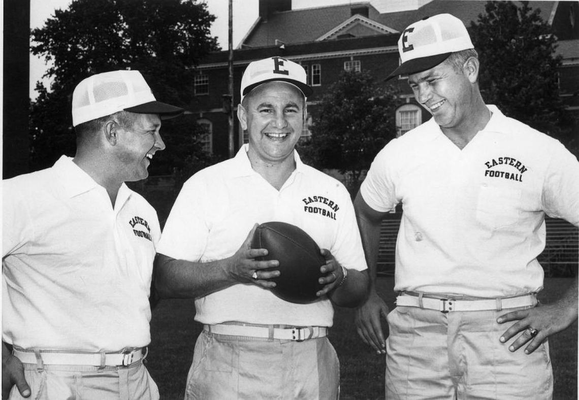 Roy Kidd, center, in 1964, before his first season as Eastern Kentucky University football coach. On Saturday, EKU will unveil a statue honoring the coach who led the Colonels to 314 wins and two I-AA (now FCS) national championships.