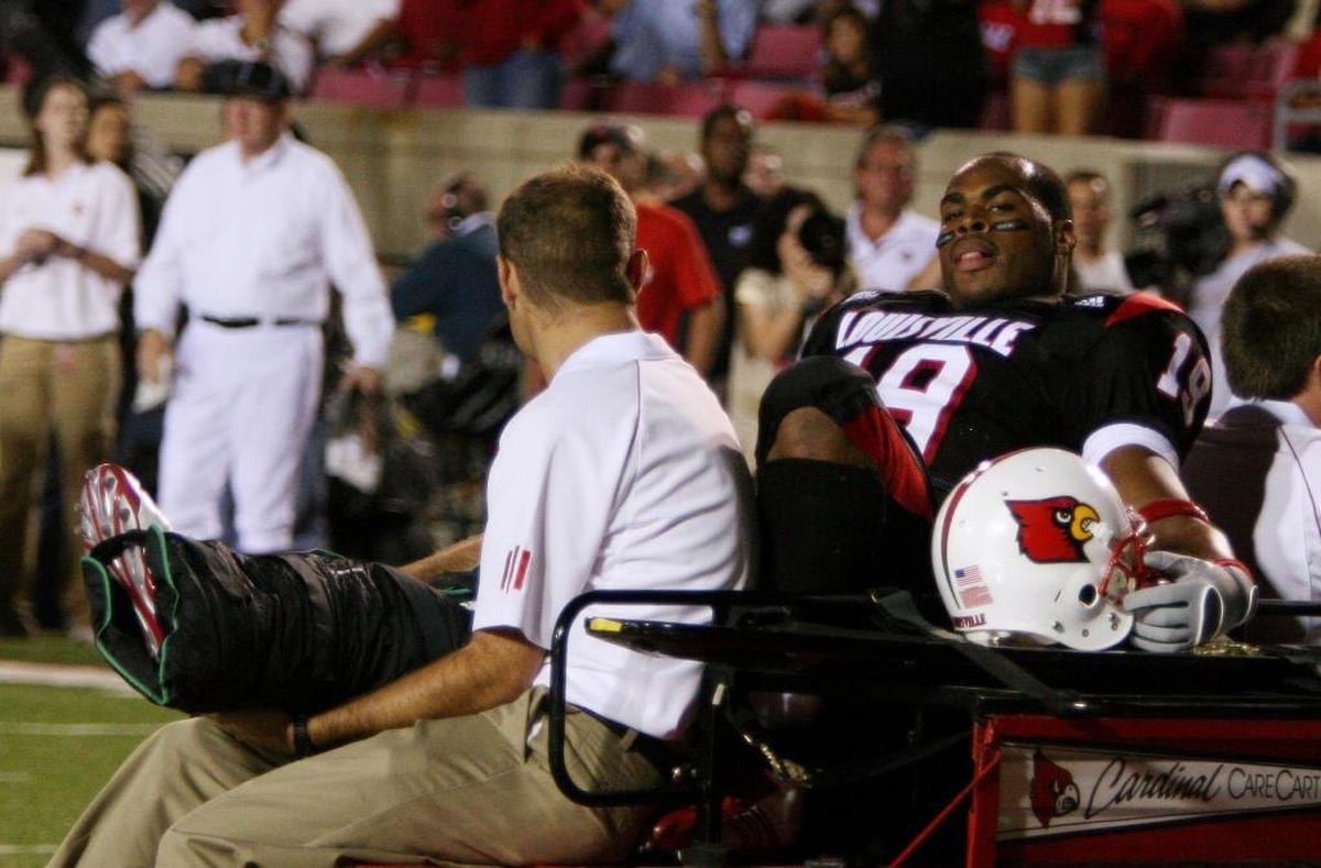 Louisville running back Michael Bush was carted off the field after breaking his leg during the second half of U of L’s 59-28 victory over Kentucky in 2006.