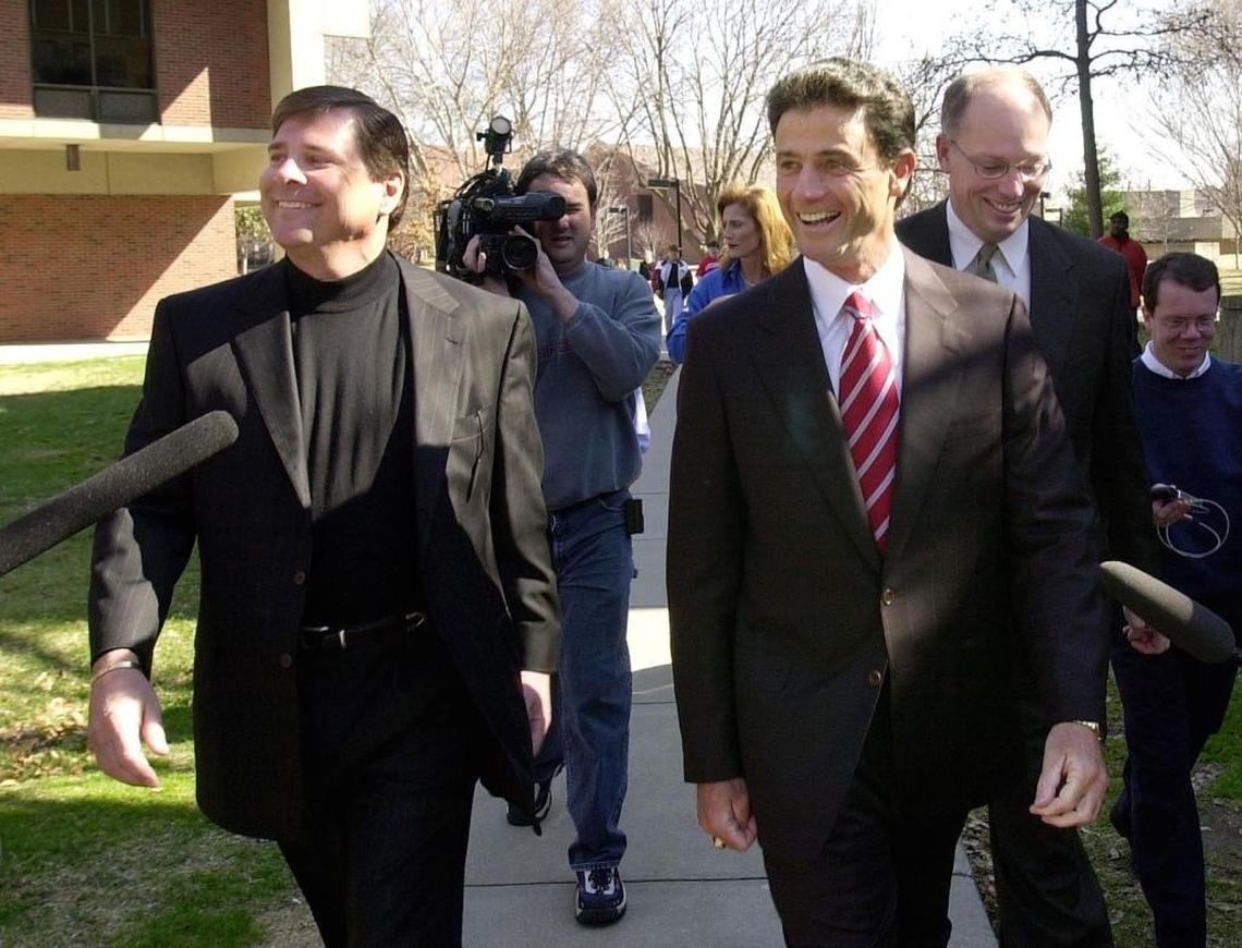 Tom Jurich, left, walked with Rick Pitino on the 2001 day when the coach toured the University of Louisville campus leading up to his becoming Cardinals’ men’s basketball coach.
