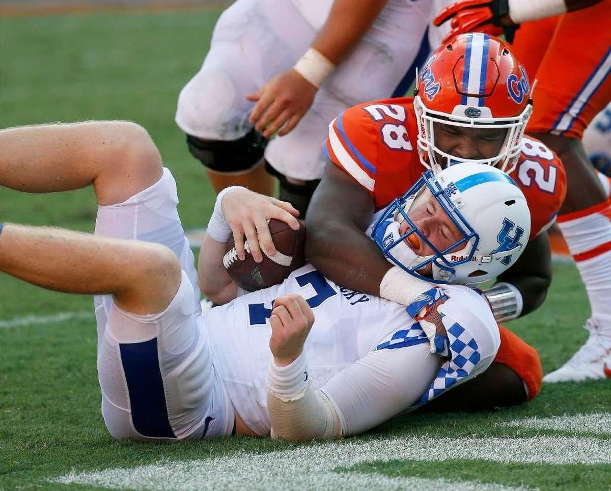 Drew Barker is hardly the only Kentucky quarterback to take a pounding from the Gators during UK’s current 30-game losing streak to Florida.