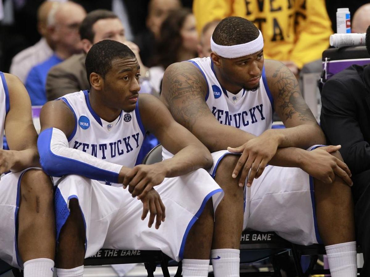 Kentucky freshmen stars John Wall, left, and DeMarcus Cousins sat dejectedly on the bench in the final seconds as West Virginia defeated Kentucky 73-66 in the 2010 NCAA Tournament round of eight.