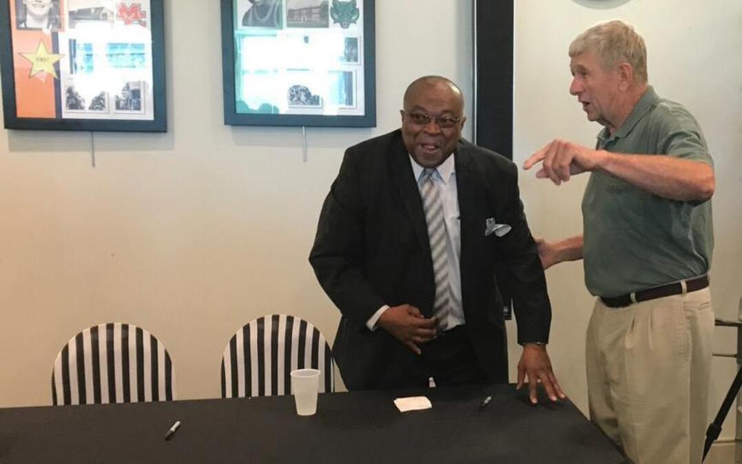 Former Dunbar guard Bobby Washington talked with Kenneth Tate of Richmond before Washington's induction into the Kentucky High School Basketball Hall of Fame in Elizabethtown.