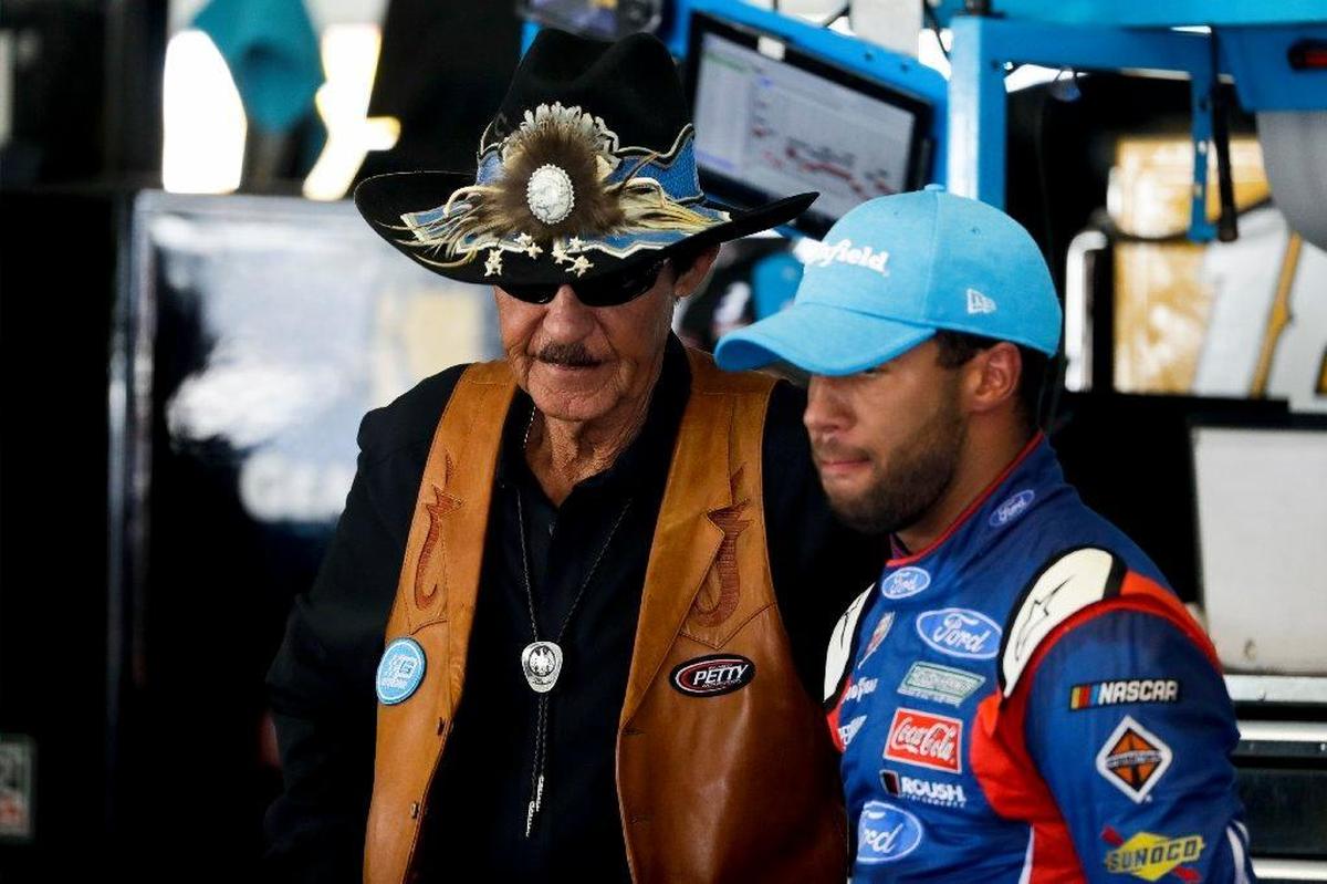 NASCAR legend Richard Petty, left, advised Darrell Wallace Jr. before the latter drove in his first Cup Series race last month at Pocono in the No. 43 Ford for Richard Petty Motorsports.