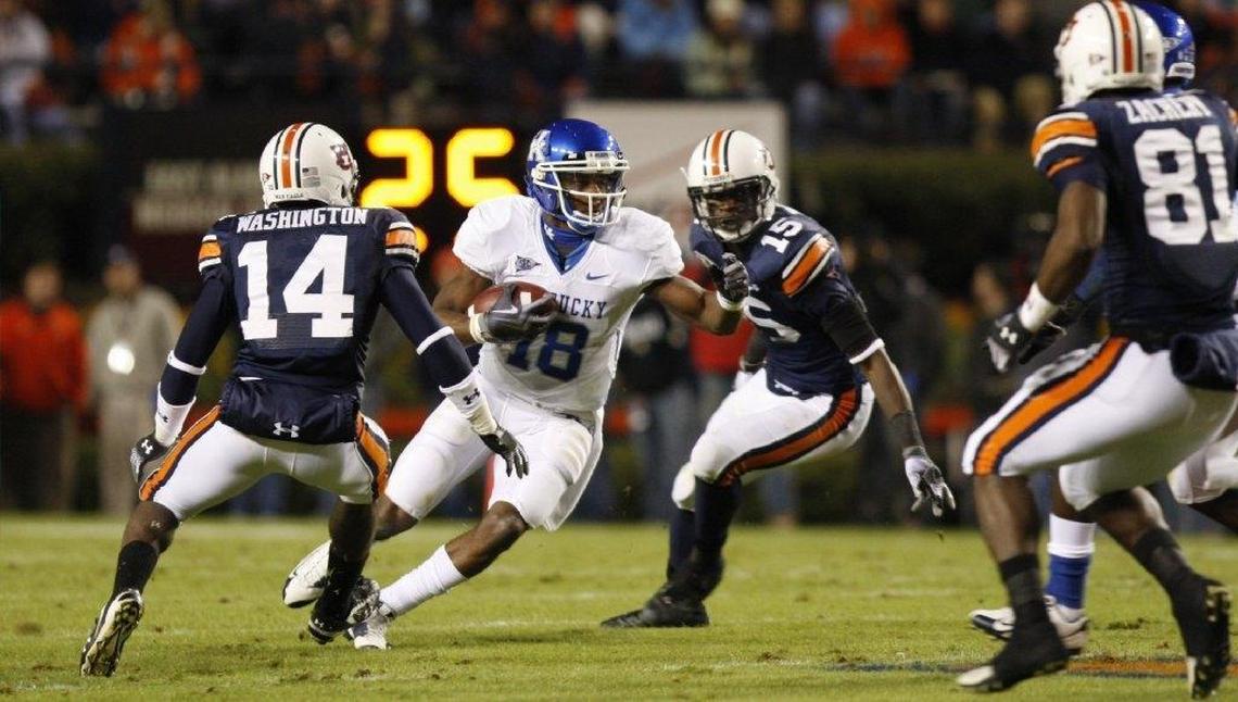 Randall Cobb, with football, helped Kentucky win at Auburn 21-14 in 2009, one of three SEC road victories the Wildcats collected that season.