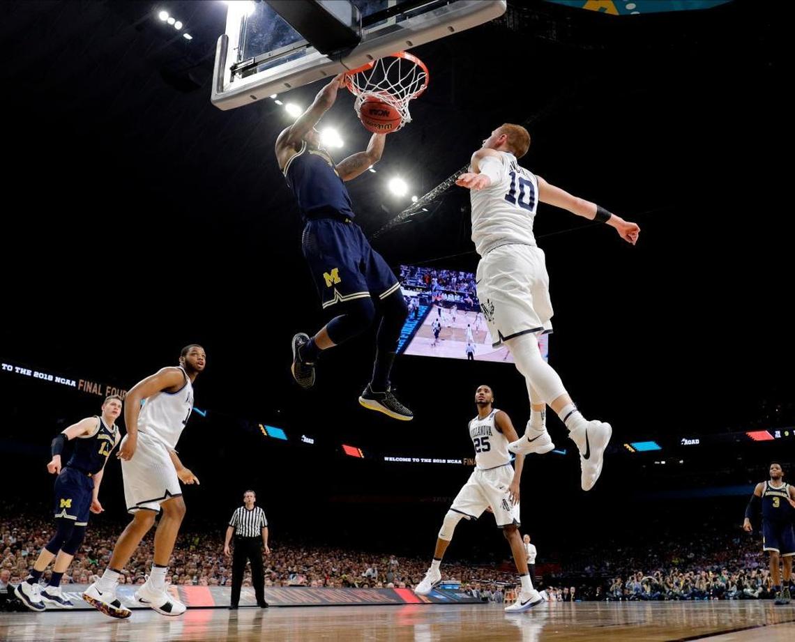 Michigan guard Charles Matthews, dunking against Villanova in the 2018 NCAA title game, averaged 1.7 points in 10.3 minutes a game as a freshman at Kentucky in 2015-16. This season for the national runner-up Wolverines, Matthews averaged 13 points a game.