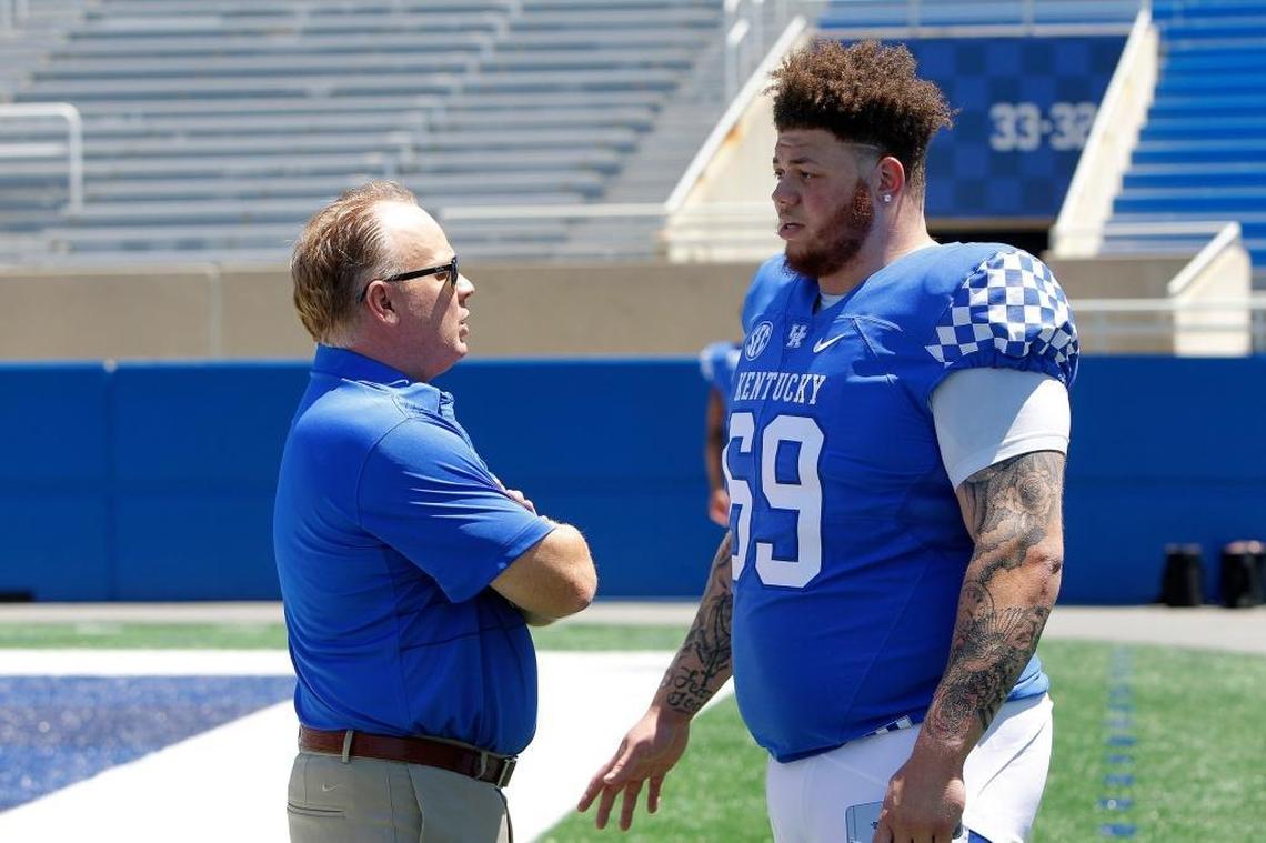 Kentucky Coach Mark Stoops spoke with Matt Elam during UK football's media day at Kroger Field. A visibly slimmed-down Elam will try to help UK improve an interior defensive front that struggled in 2016.