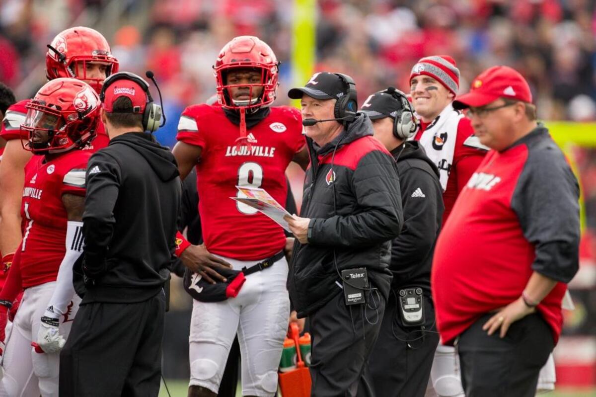Even with reigning Heisman Trophy winner Lamar Jackson, No. 8, Louisville and Coach Bobby Petrino, center in black coat, have gone 7-7 in the past 14 games.