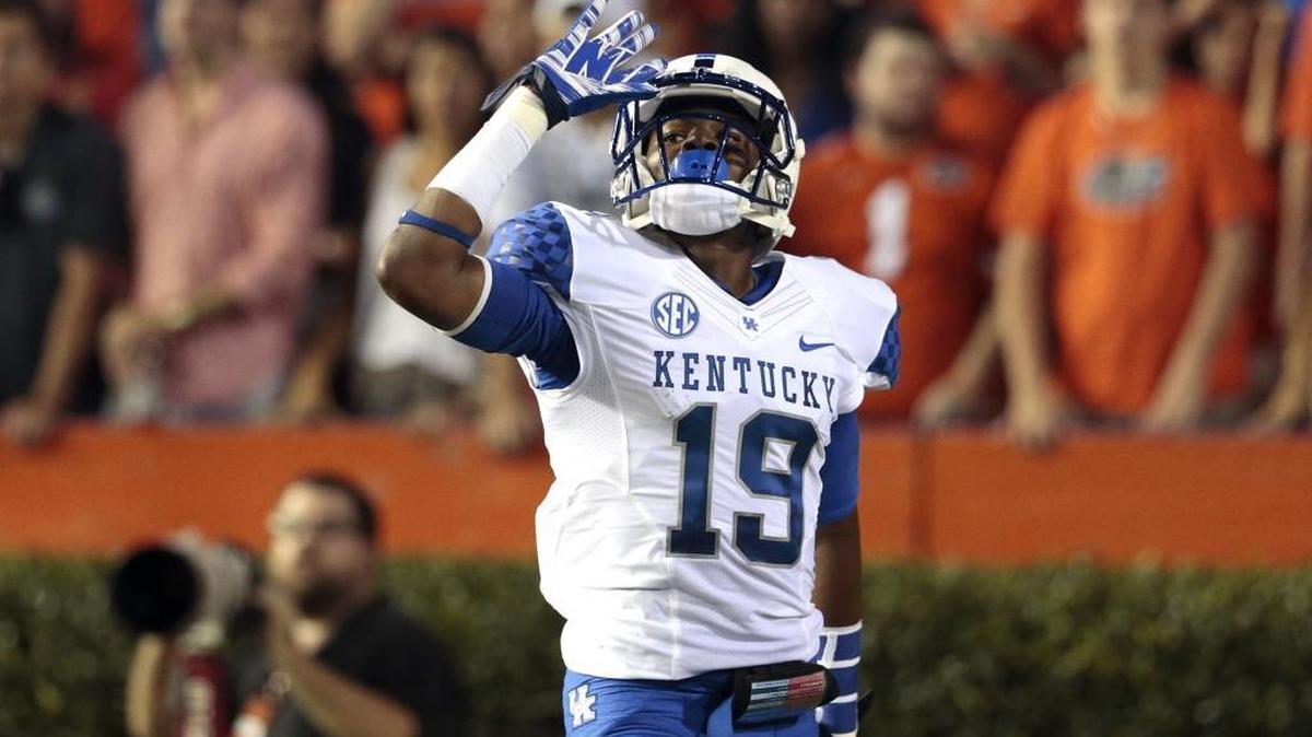 Kentucky wide receiver Garrett Johnson celebrated one of his two touchdown catches in Kentucky’s 36-30 triple-overtime loss at Flordia in 2014. When the Gators visit Kroger Field Saturday night, the senior from Winter Garden, Fla., has one more chance to help UK end its embarrassing 30-year losing streak to Florida.