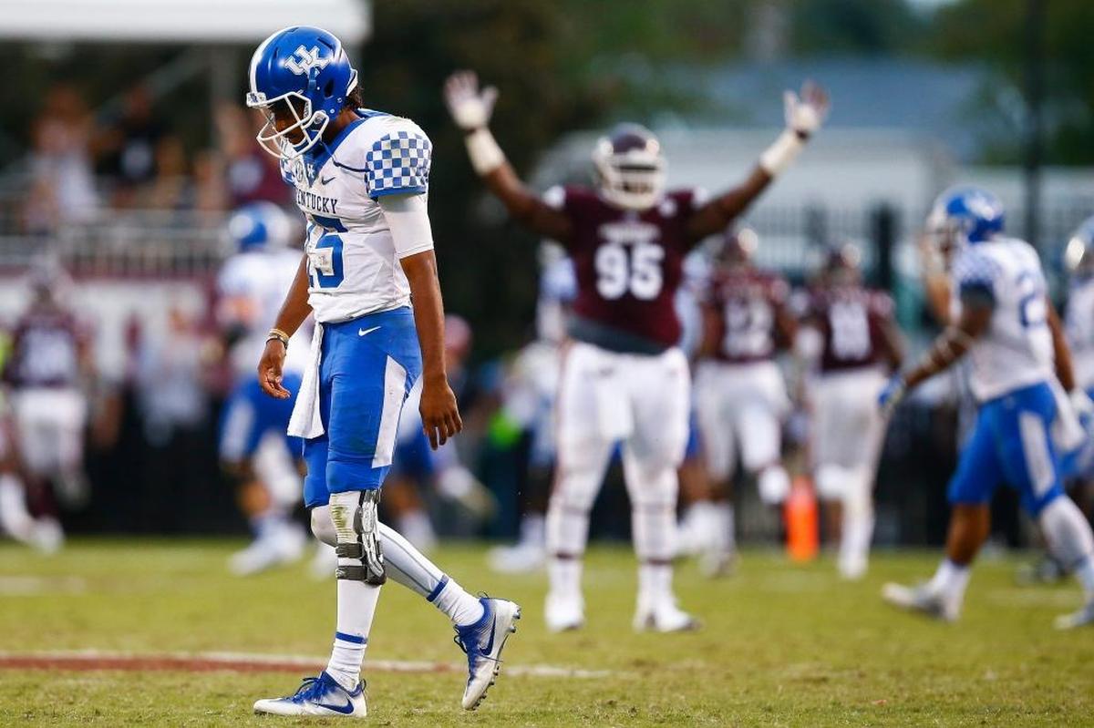 Kentucky quarterback Stephen Johnson, No. 15, reacted afterMississippi State linebacker Gerri Green returned an interception 84 yards for a touchdown in MSU’s 45-7 win over UK.