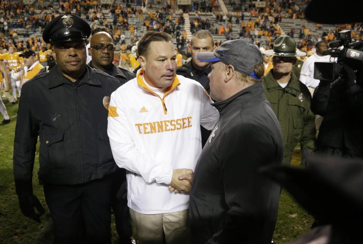 Even with all the turmoil that has engulfed University of Tennessee athletics since 2008, one thing hasn’t changed: Tennessee head football coach Butch Jones, left, is 4-0 against Kentucky and coach Mark Stoops.