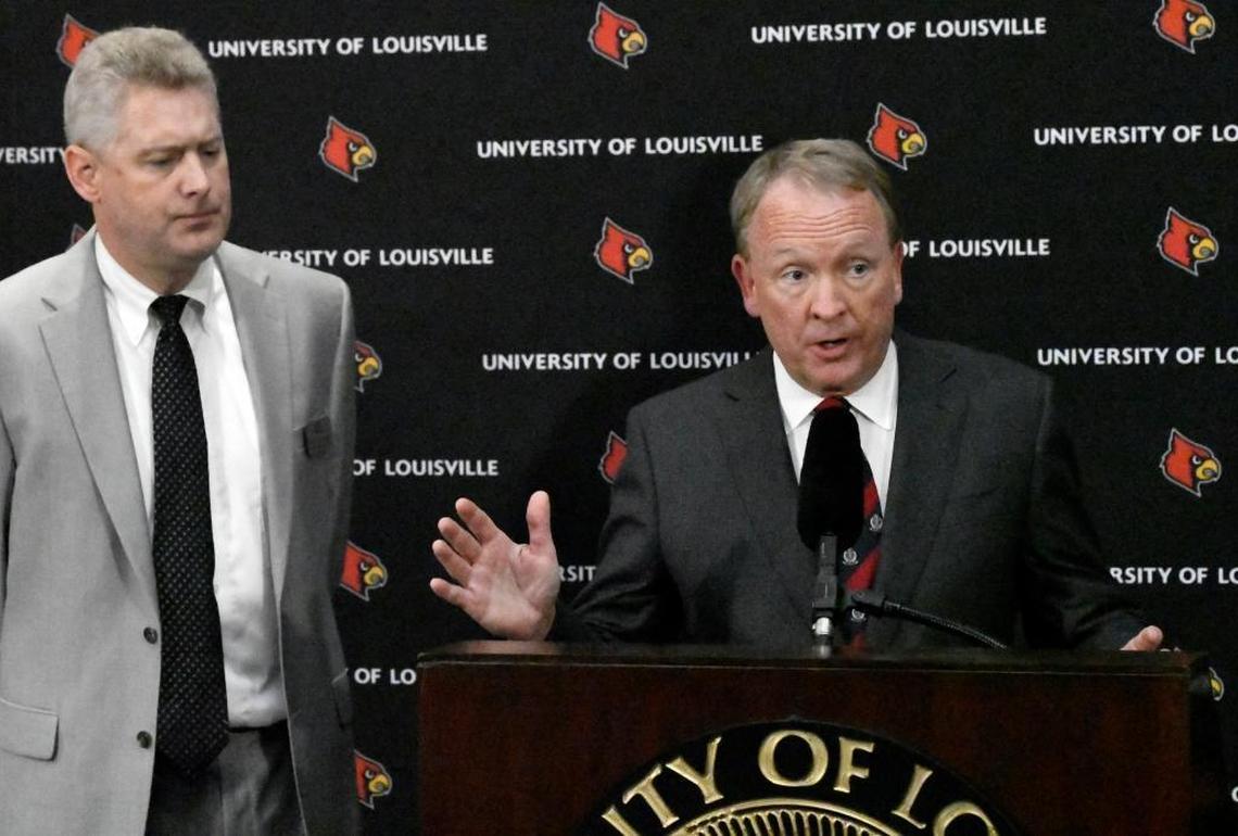 University of Louisville interim president Greg Postel, right, announced Wednesday that U of L has placed men’s basketball coach Rick Pitino and Athletics Director Tom Jurich on administrative leave. Jurich is on paid leave, while Pitino is on unpaid leave.