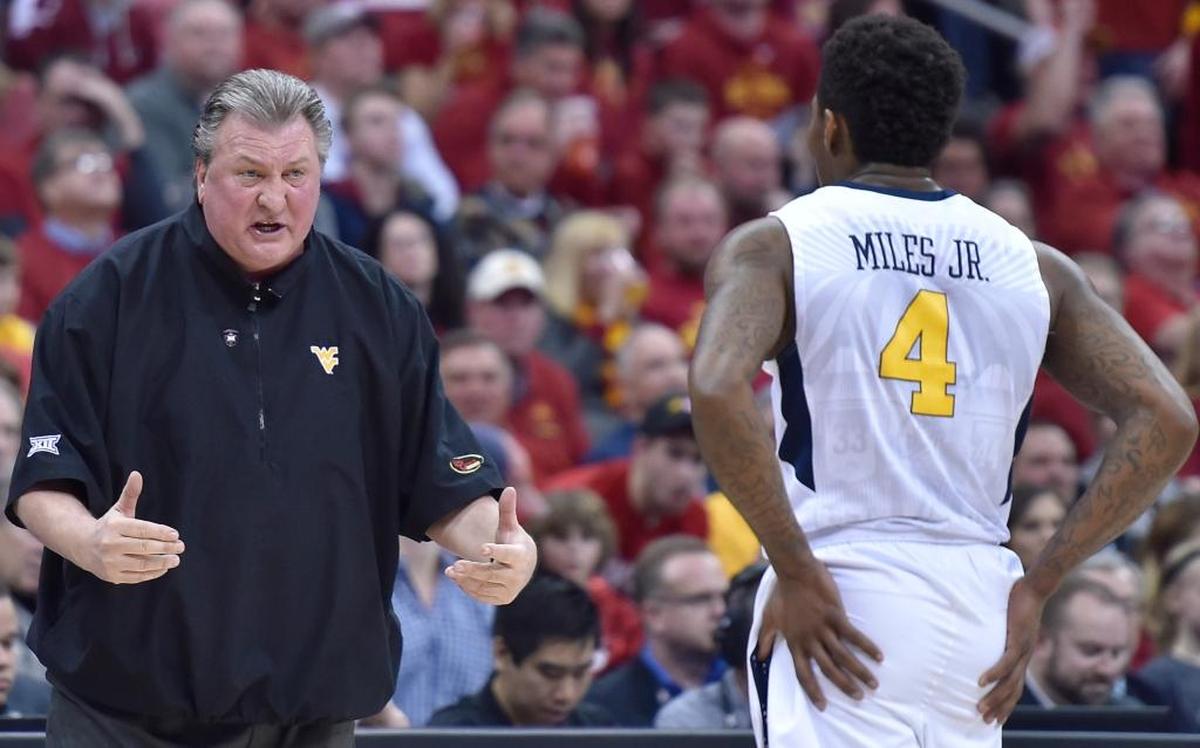 Before he became Kentucky coach, John Calipari was 1-7 against teams coached by Bob Huggins, left. Since becoming UK head man, Calipari is 3-1 against Huggins-coached teams.