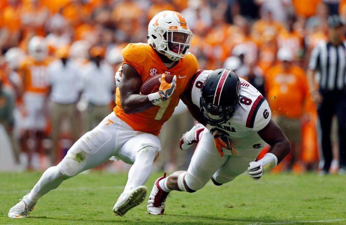 Tennessee running back John Kelly, with ball, leads the Volunteers in both rushing (619 yards) and pass receptions (26).