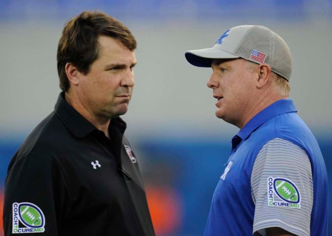 When Kentucky visits South Carolina Sept. 16, UK Coach Mark Stoops, right, will be seeking his fourth straight win over the Gamecocks. Two of those came against ex-South Carolina head man Steve Spurrier, while last year’s win came against current Gamecocks Coach Will Muschamp, left.