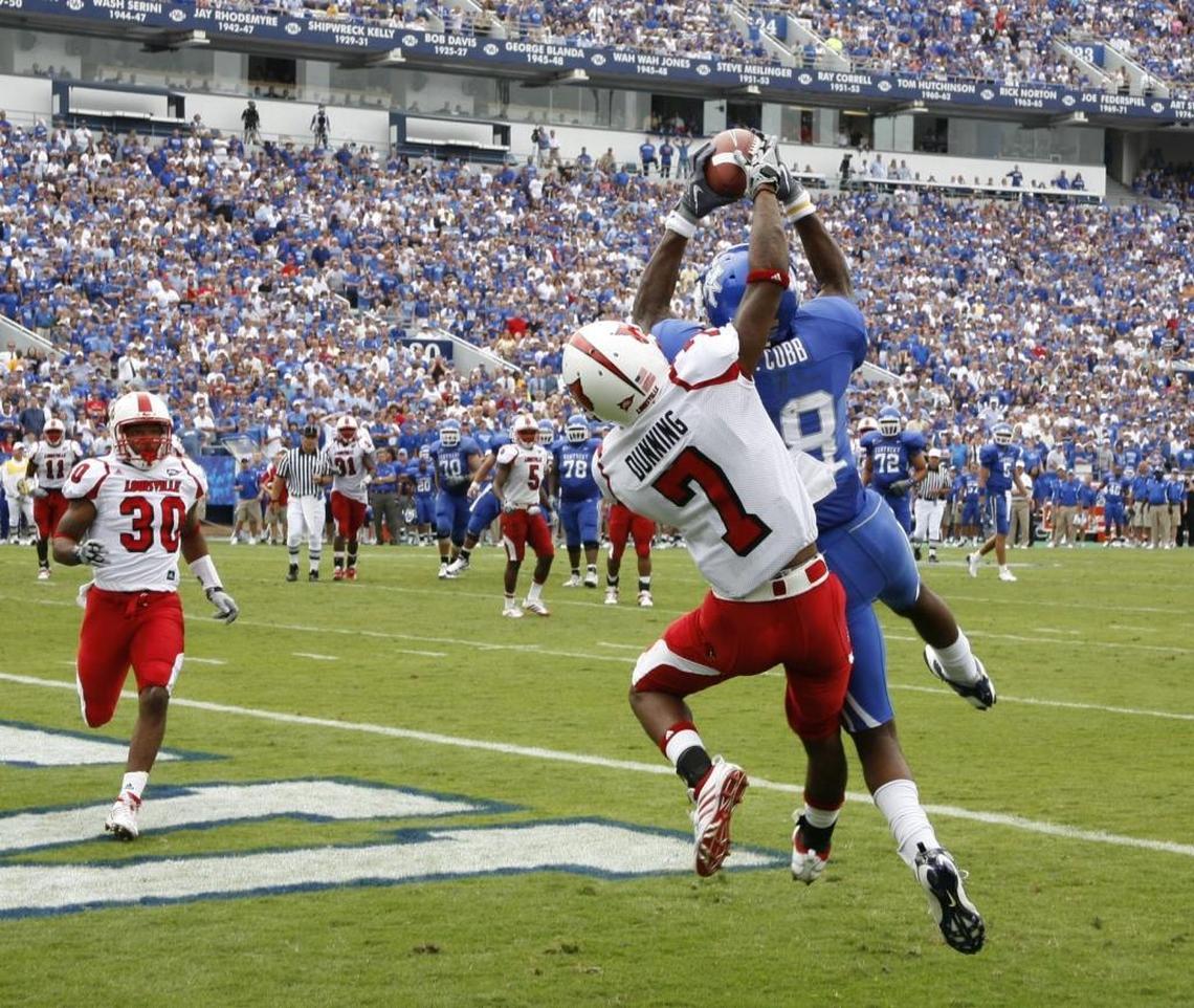 Kentucky star Randall Cobb caught the game-winning touchdown in front of Louisville’s Darldell Dunning (7) in the fourth quarter of UK’s 31-27 win over U of L in 2009.