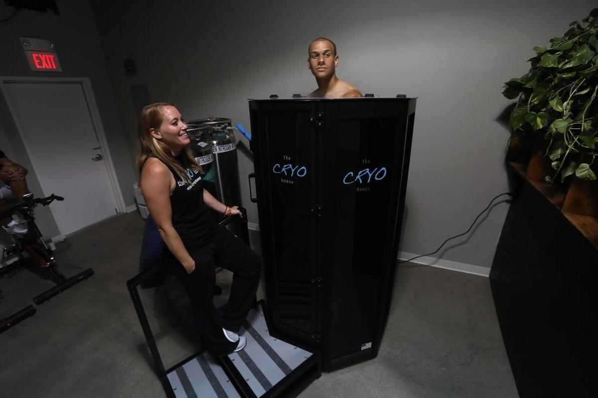 Tammy Breitner, owner of Lexington’s The CRYO House, monitors Louisville City FC defnder Luke Spencer in the cryotherapy chamber Tuesday.