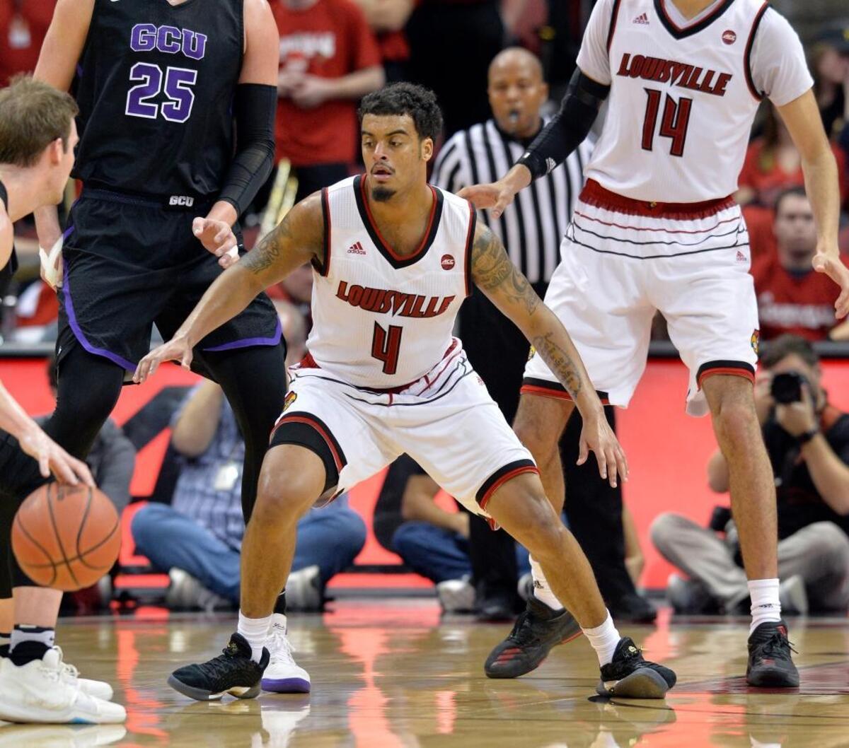Former Ballard High School star Quentin Snider (4) had 22 points, six rebounds and five assists in the Cardinals’ 73-70 win over Kentucky last season in the KFC Yum Center.