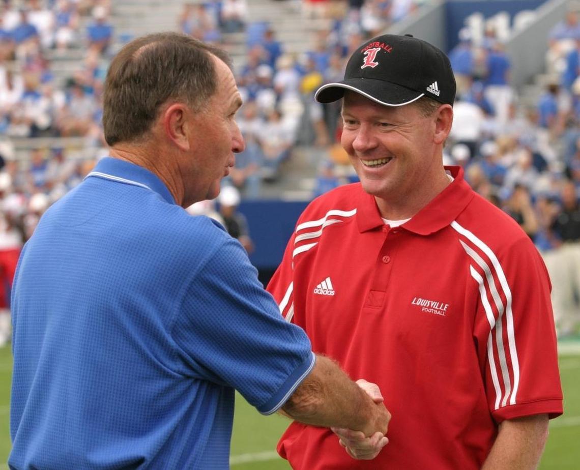 Kentucky’s Rich Brooks shook hands with Louisville’s Bobby Petrino before the two head coaches faced each other for the first time in 2003. Petrino’s Cardinals went on to win the game 40-24. In Governor’s Cup games, Petrino went 4-0 vs. Brooks-coached Kentucky teams.