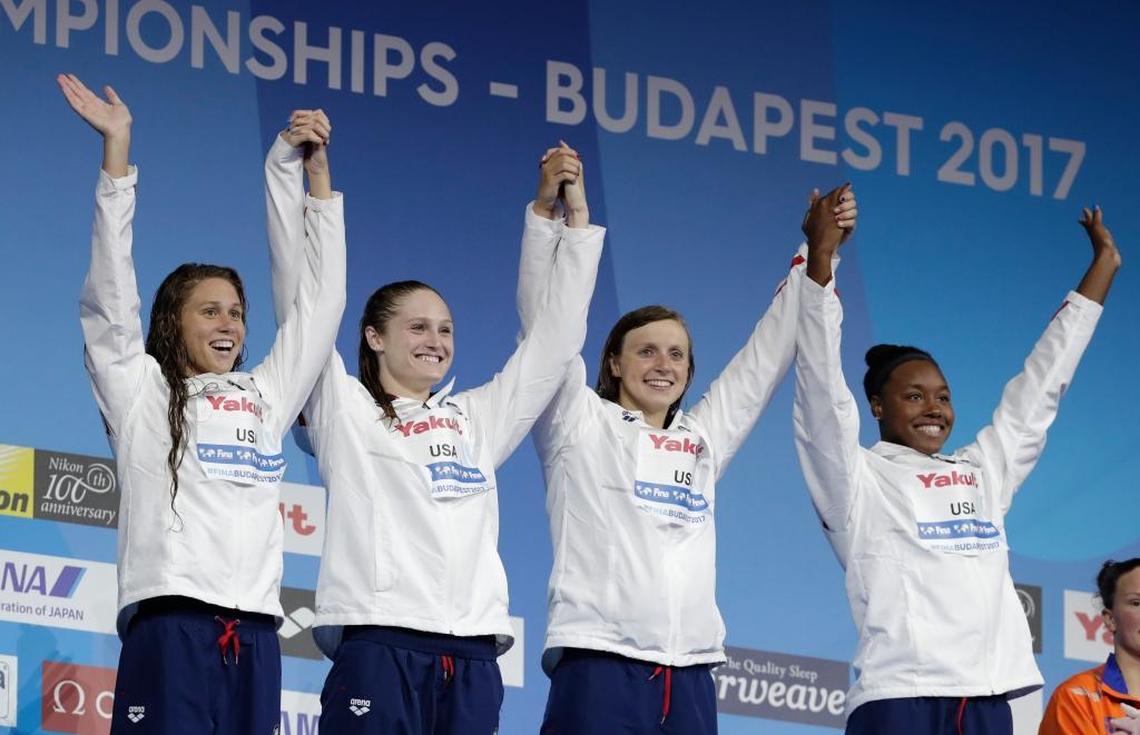 Louisville Cardinals swimming star Mallory Comerford with ex-U of L star Kelsi Worrell, Katie Ledecky, and Simone Manuel, from left, after winning the gold medal in the women’s 4-by-100-meter freestyle relay at the World Championships in Budapest, Hungary, last July.