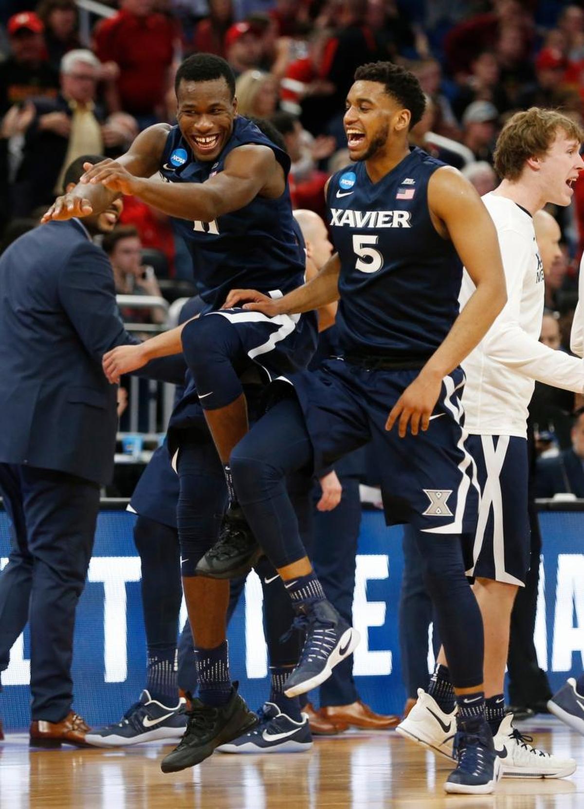 Xavier’s Malcolm Bernard, left, and Trevon Bluiett, No. 5, celebrate after No. 11 seed Xavier defeated No. 6 Maryland 76-65 last year during the NCAA men’s basketball tournament round of 64. In each of the past two men’s NCAA tourneys, No. 11 seeds have gone 3-1 against No. 6 seeds.