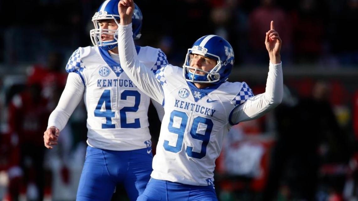 Kentucky place-kicker Austin MacGinnis, No. 99, celebrated his game-winning 47-yard field goal in the final seconds that upset No. 11 Louisville 41-38 last season.