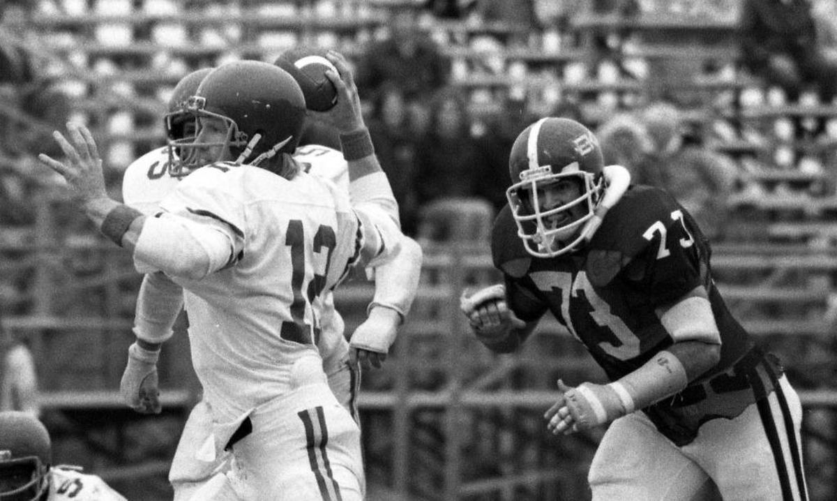Morehead State quarterback Phil Simms, No. 12, threw under pressure from an Eastern Kentucky defender during the Colonels 30-0 win Nov. 18, 1978 in Richmond. It was Simms' final college game before becoming a first-round draft choice by the New York Giants.