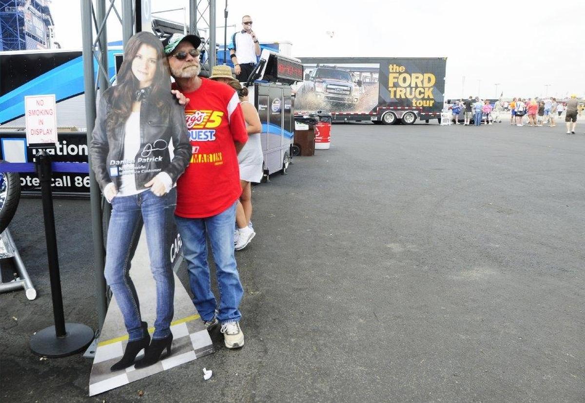 Before the first Cup Series race at Kentucky Speedway in 2011, Chuck Sampson of Carrollton posed with a life-size, cardboard cut-out of driver Danica Patrick.