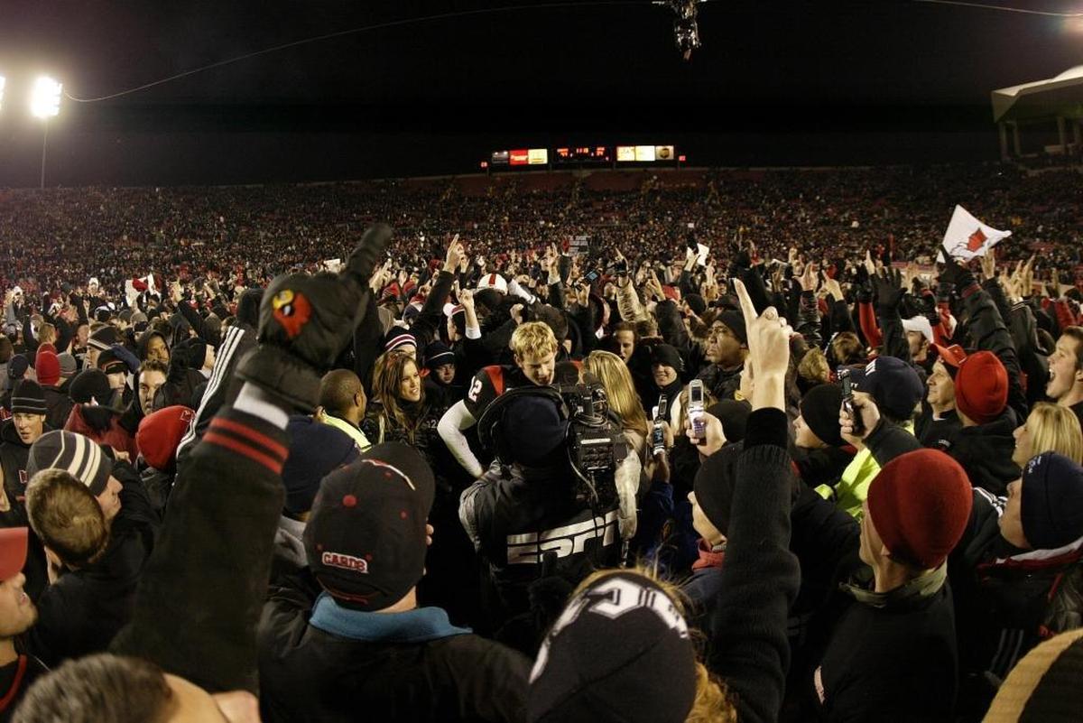 Louisville quarterback Brian Brohm was interviewed as fans flooded the field at Papa John’s Stadium after Louisville defeated West Virginia 44-34 on Nov. 2, 2006 in Louisville