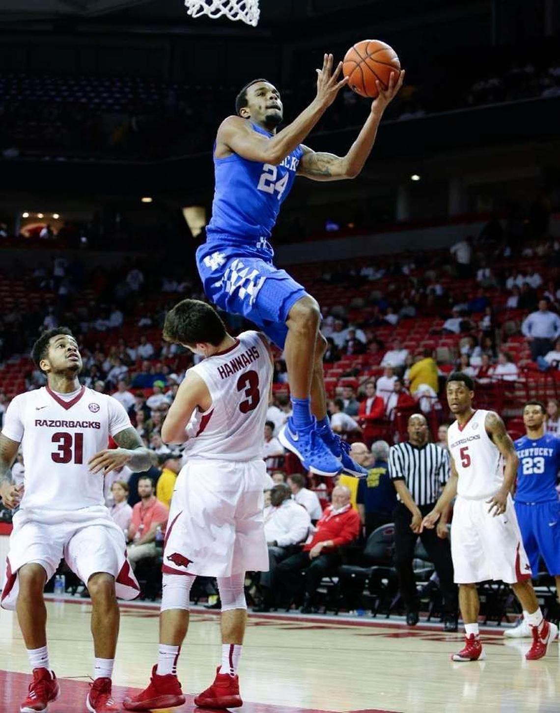 EJ Floreal, with ball, played basketball for Kentucky for three seasons, but gave up hoops to run track for his father, UK track and field coach Edrick Floreal.