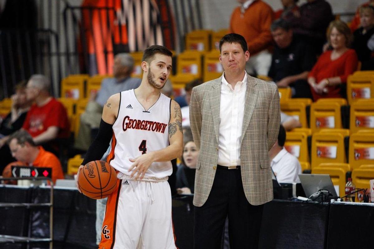 Georgetown College Coach Chris Briggs, right, led the Tigers to NAIA Division I national titles in 2013 and 2019.