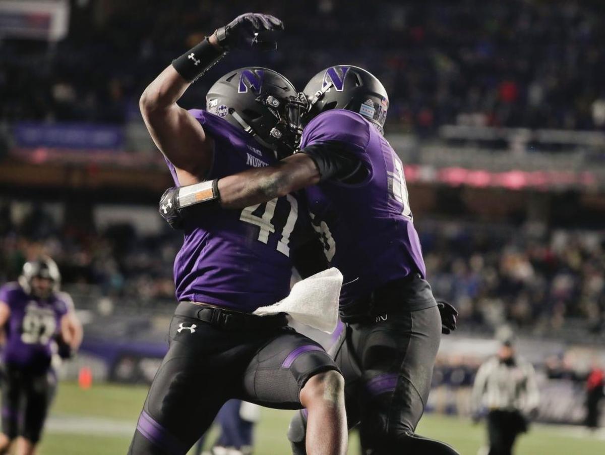 Northwestern safety Godwin Igwebuike, right, has 72 tackles, nine pass breakups and two interceptions this season.