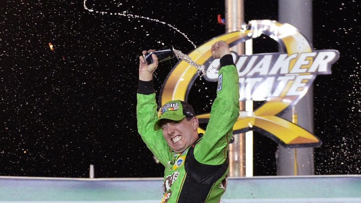 Kyle Busch sprayed his drink in Victory Lane after winning last year’s NASCAR Sprint Cup race at Kentucky Speedway. Busch also won there in 2011.