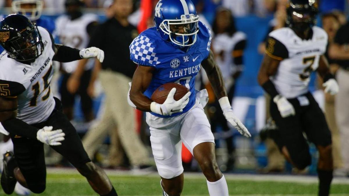 Kentucky Wildcats wide receiver Garrett Johnson, with ball, took this Drew Barker pass 43 yards for a touchdown in UK’s 44-35 season-opening loss to Southern Mississippi in 2016.