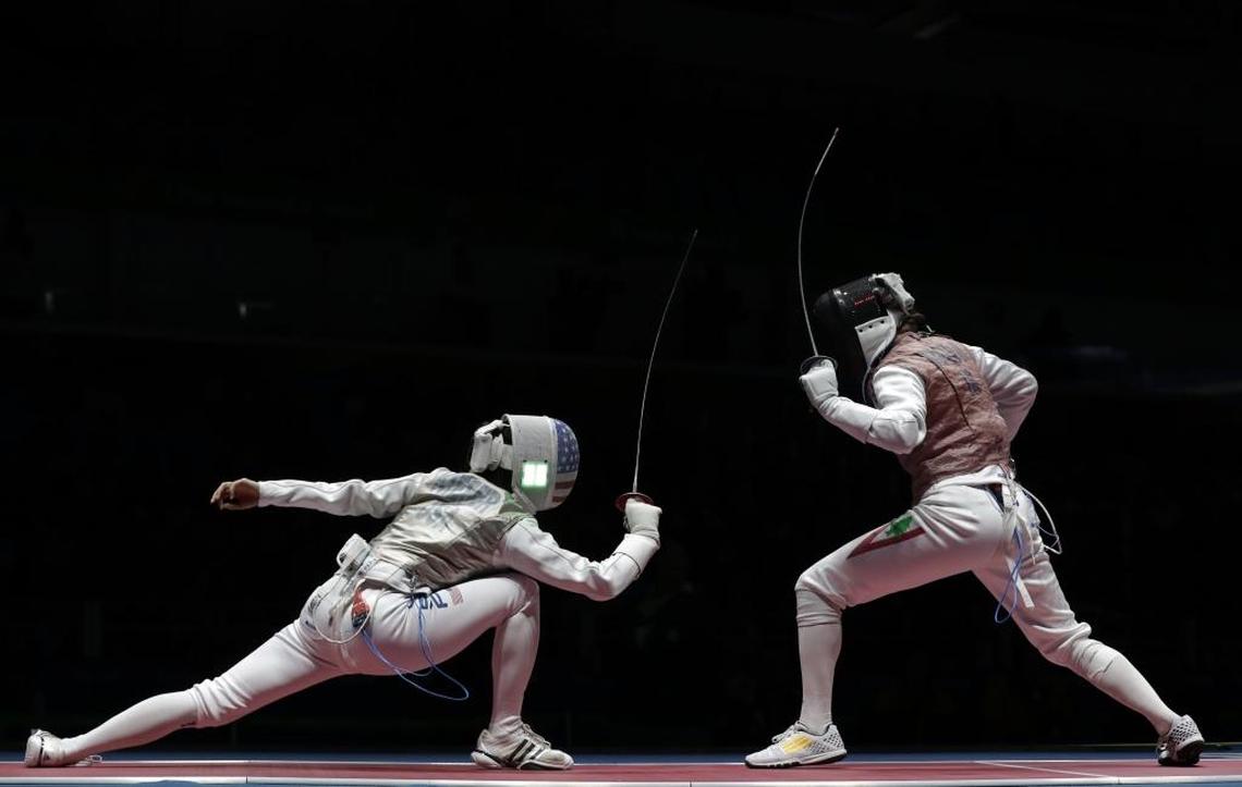 Lexington fencer Lee Kiefer, left, rose to No. 1 in the world in foil in 2017, the first American woman ever to achieve that status.