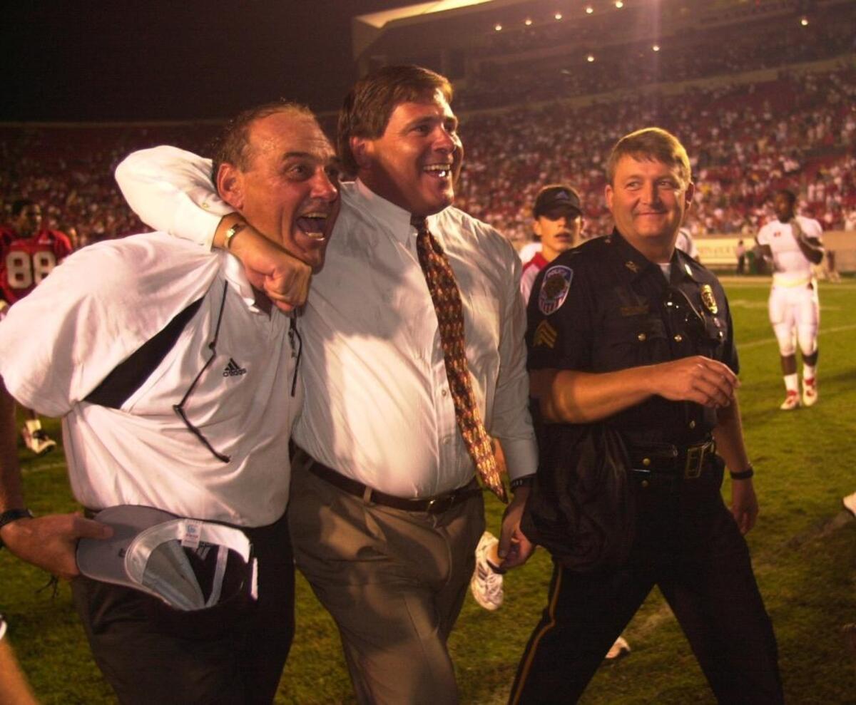 John L. Smith, left, seemed a little over-caffienated they day then-new Louisville Athletics Director Tom Jurich, right, introduced him as Cardinals head football coach. But after inheriting a program coming off a 1-10 season in 1997, Smith led U of L to five-straight bowl games.