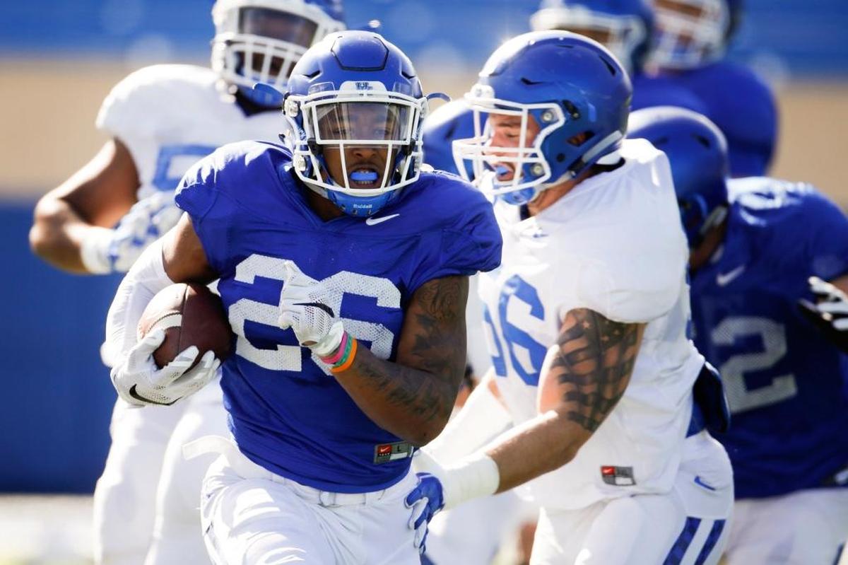 Kentucky linebacker and former Paintsville High School star Kash Daniel, No. 56 in white, tried to tackle UK runningback Benny Snell during spring practice. Daniel, Kentucky’s 2015 Mr. Football, had 19 tackles for the Wildcats last season as a true freshman.