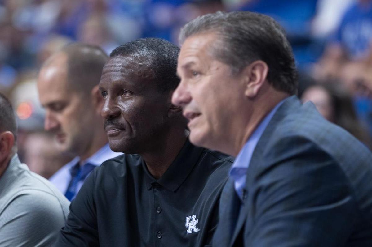 Dwane Casey talks with Kentucky head coach John Calipari during a UK alumni charity basketball game in Rupp Arena. Casey will be inducted Tuesday night into the Kentucky Sports Hall of Fame along with five others.