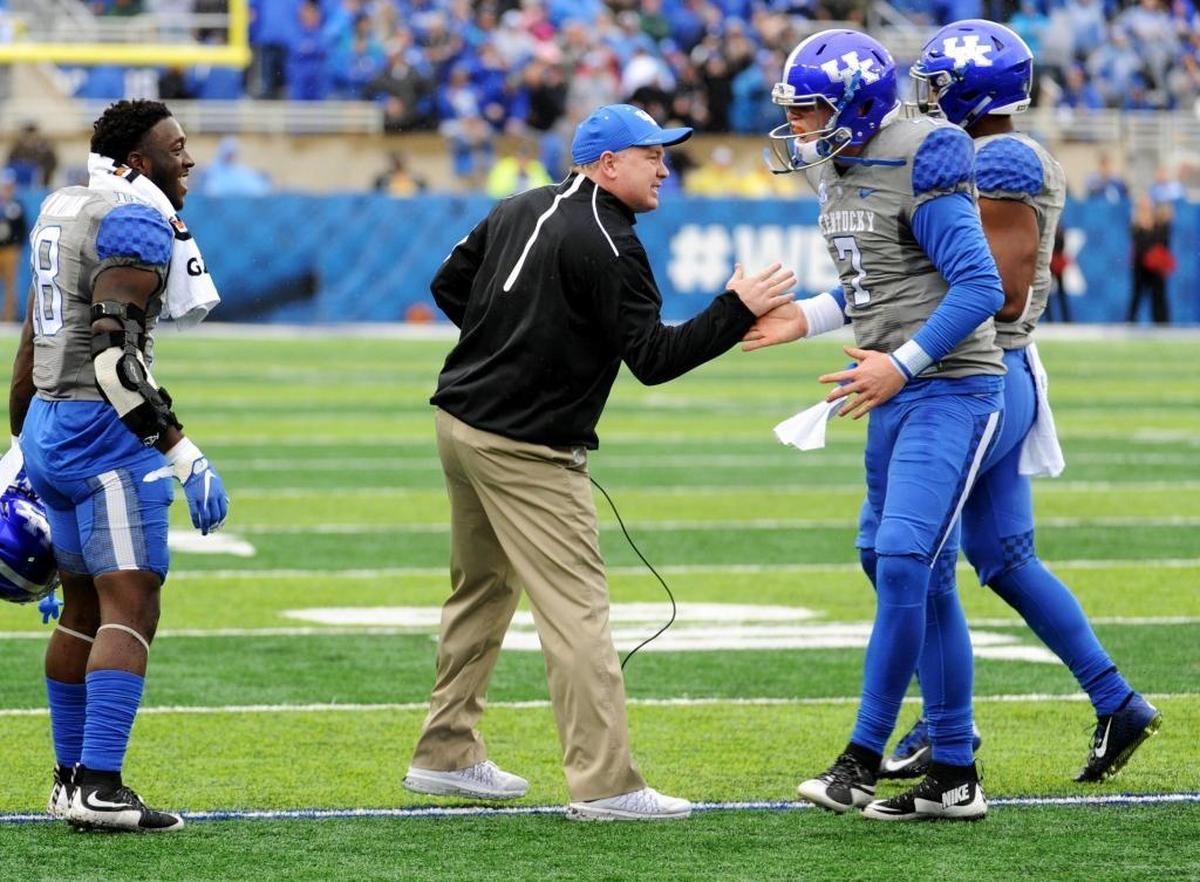 Kentucky head coach Mark Stoops, left, says of quarterback Drew Barker (7), “I honestly had total confidence when he went in the (Tennessee) game.”