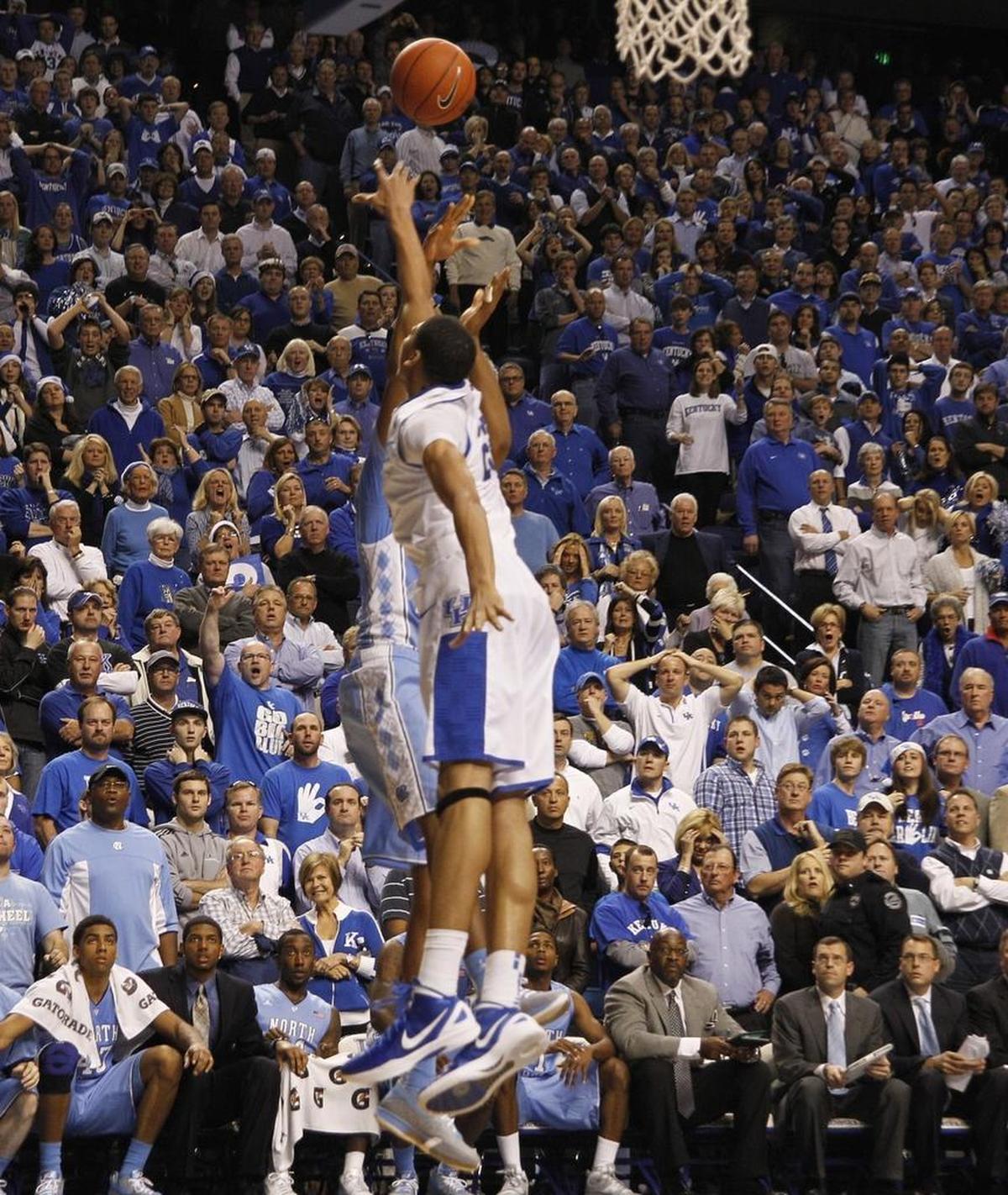 Kentucky’s Anthony Davis, foreground, blocked the shot of North Carolina forward John Henson to preserve UK’s 73-72 victory over UNC in Rupp Arena on Dec. 3, 2011.