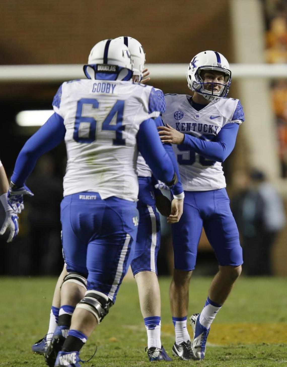 Austin MacGinnis, No. 99, celebrated after setting the Kentucky school record for longest made field goal by booting a 54-yard kick at Tennessee in 2014.