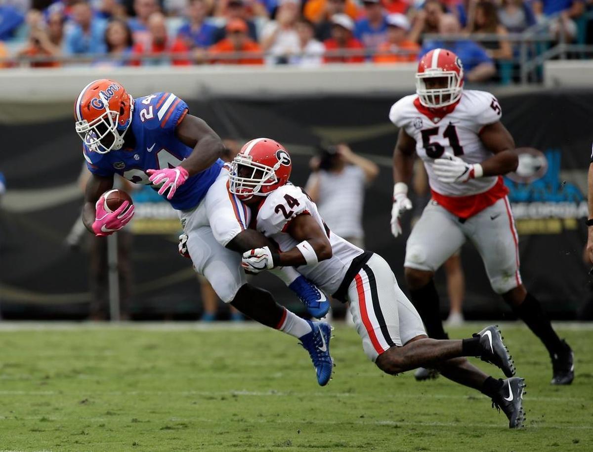 Georgia senior safety Dominick Sanders, making tackle, has intercepted 15 passes in his Bulldogs career. He had two picks against Kentucky in 2015.