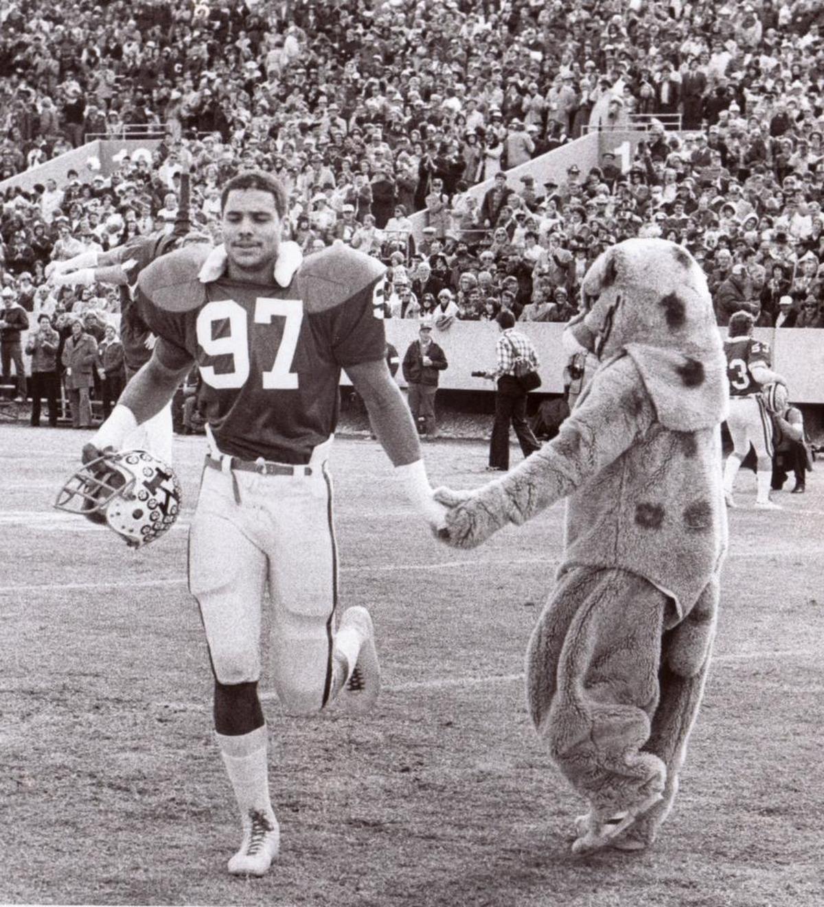 Kentucky star defensive end Art Still, No. 97, was greeted by The Wildcat mascot before UK closed out is 10-1 1977 season with a 21-17 home victory over Tennessee.