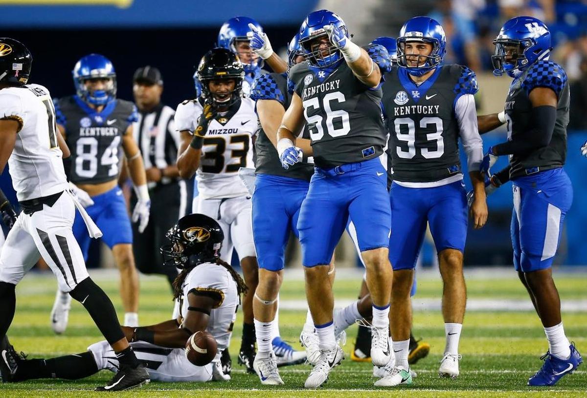 Kentucky linebacker Kash Daniel (56) celebrated after converting a first down on a fake punt in the fourth quarter of UK’s 40-34 win over Missouri last season at Kroger Field.