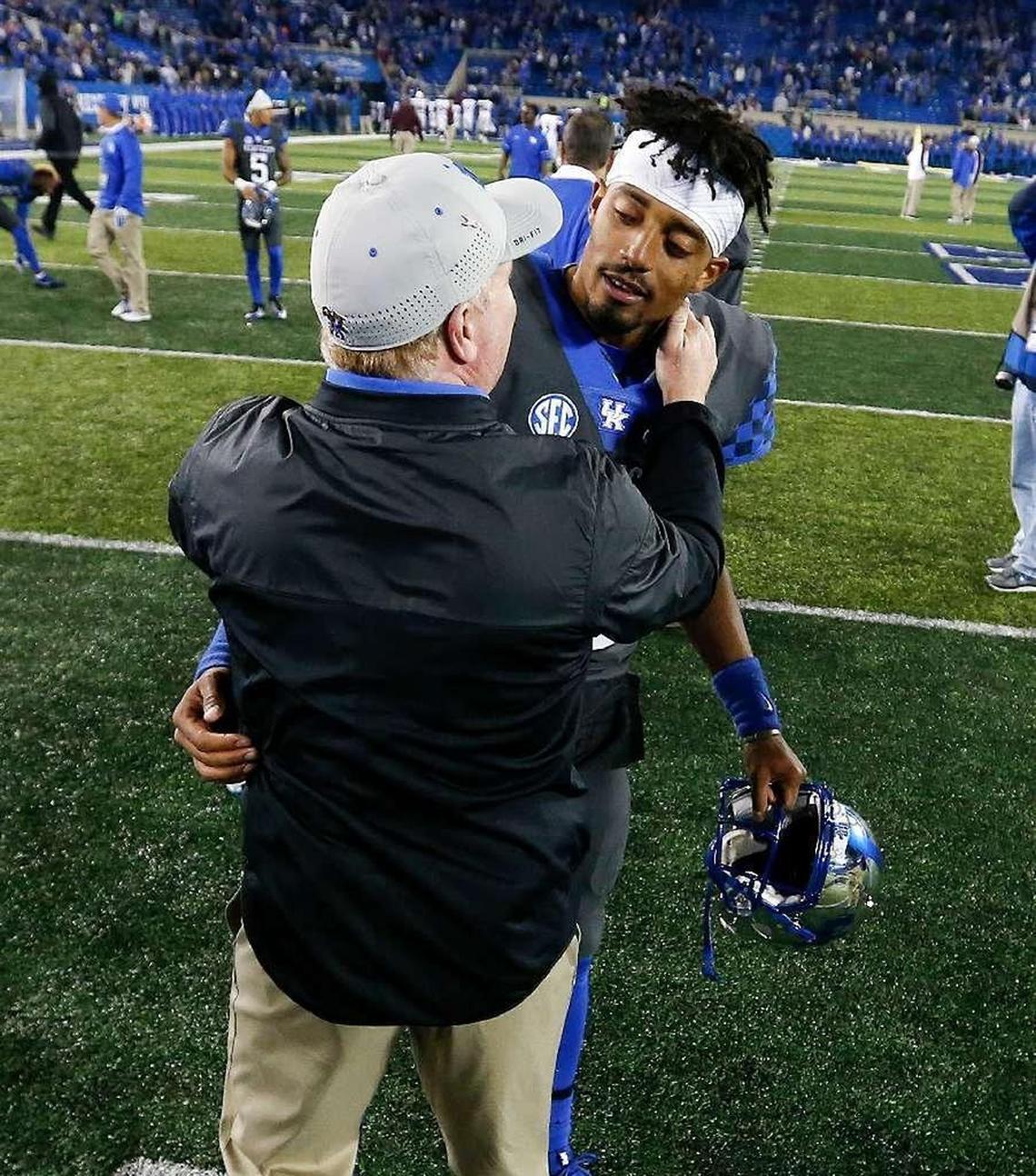 Kentucky Coach Mark Stoops, foreground, had Stephen Johnson, background, listed No. 1 on the UK depth chart at quarterback for the Southern Mississippi game.