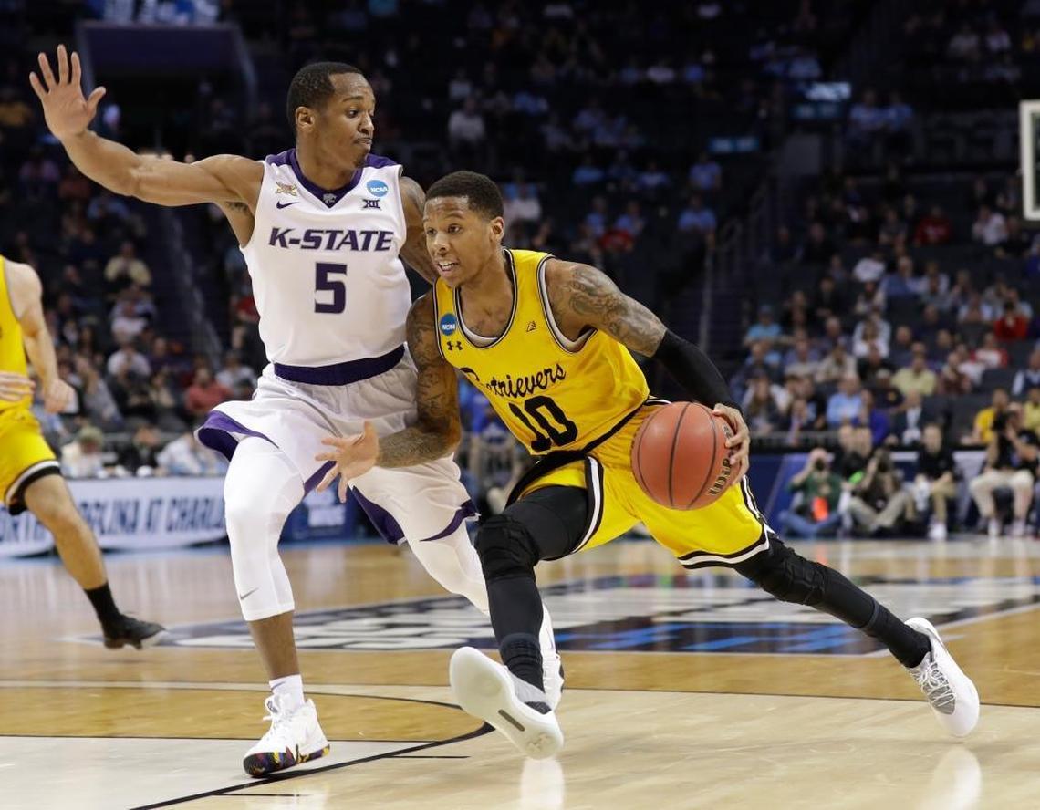 The defense of Kansas State’s Barry Brown (5) held Maryland-Baltimore County star Jairus Lyles to 4-of-15 shooting and 12 points in KSU’s 50-43 win over UMBC in the NCAA Tournament round of 32.