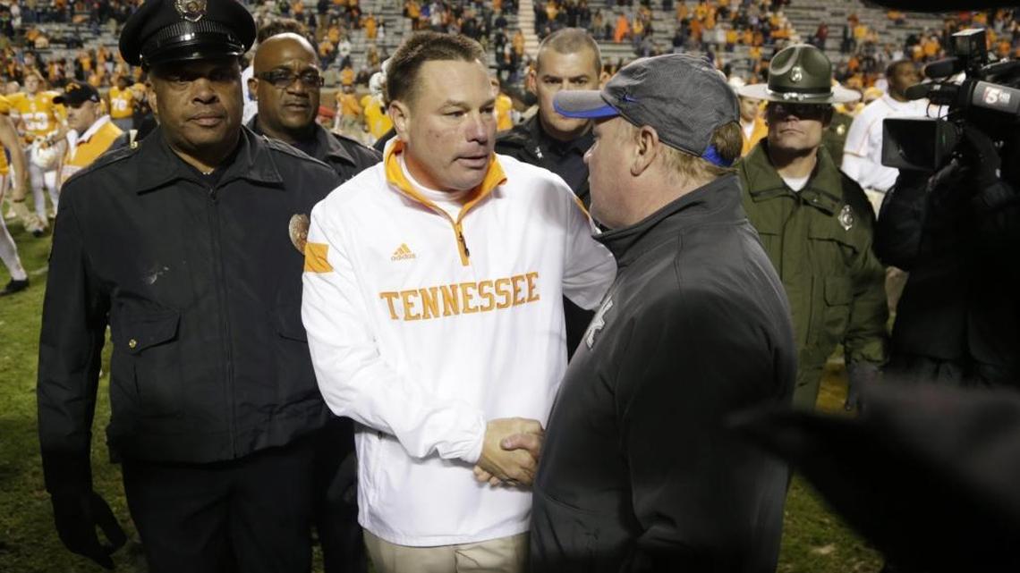 Kentucky Coach Mark Stoops, right, has shaken hands with Tennessee head man Butch Jones as the losing coach all four times the Wildcats have played the Volunteers since Stoops and Jones each began their current jobs.