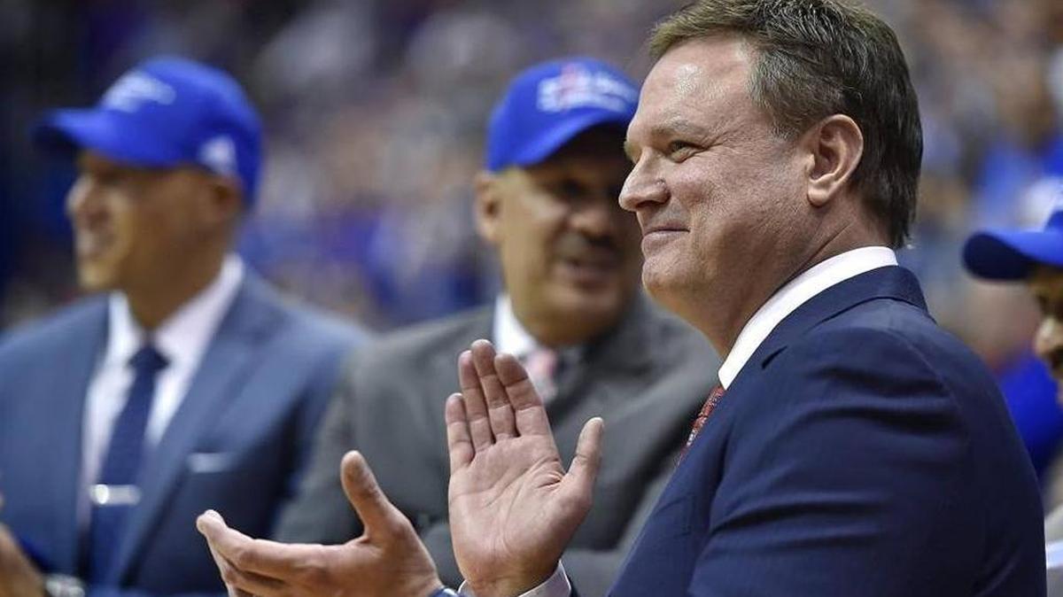 After the Jayhawks clinched their 12th consecutive Big 12 Conference title Saturday, Kansas coach Bill Self and his staff watched the players cut down the nets after the defeated Texas Tech 67-58 at Allen Fieldhouse.