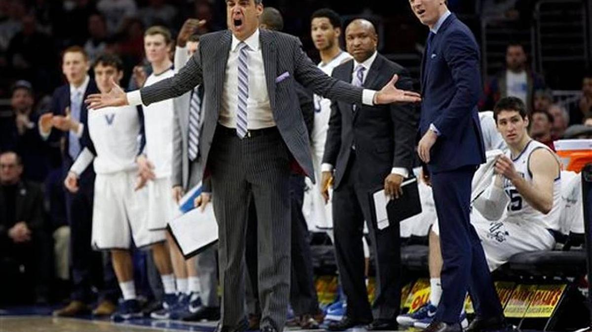 Villanova’s head coach Jay Wright, center, reacts to the call on the court with his team behind him during the first half of an NCAA basketball game against Providence, Sunday, Jan. 24, 2016, in Philadelphia.