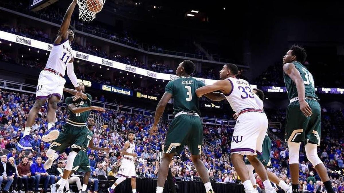 KU’s Josh Jackson threw down an early dunk after getting by UAB’s Dirk Williams during the first half of Kansas’ 83-63 win on Monday night in the CBE Classic semi-final game at the Sprint Center.